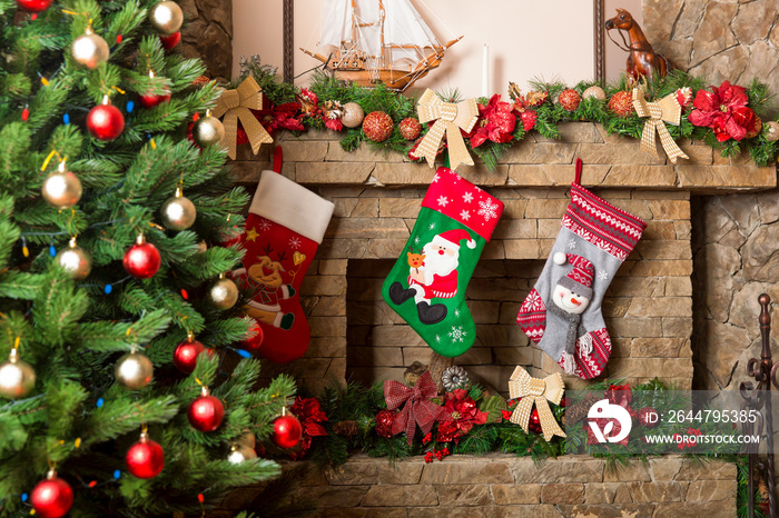 Stone fireplace decorated with christmas stockings