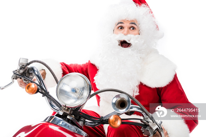 excited santa claus in costume riding on scooter isolated on white background