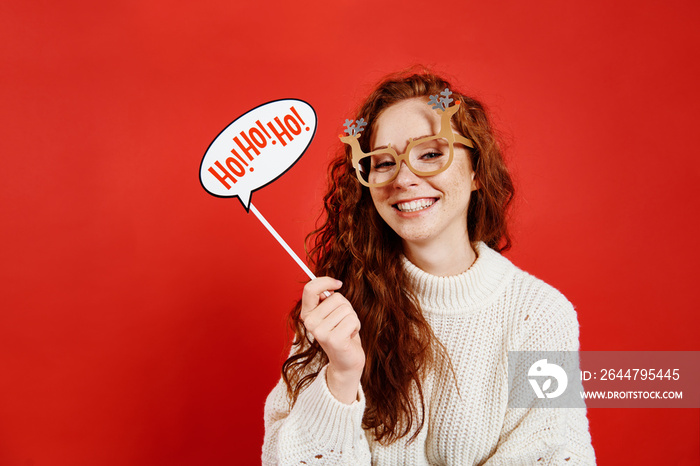 Portrait of playful girl celebrating Christmas