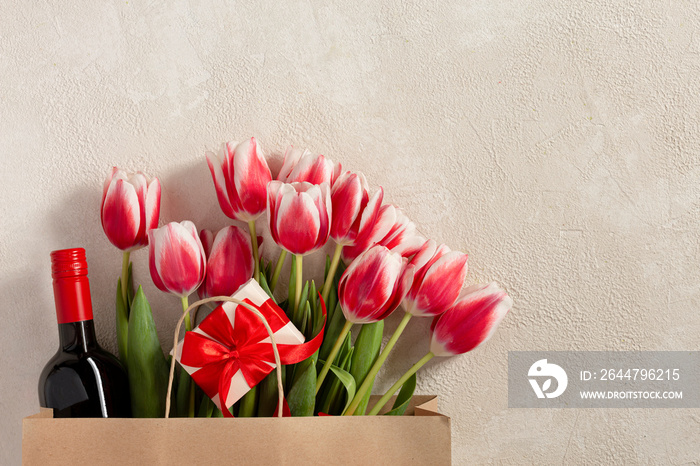 Happy birthday greetings concept. St. Valentines Day, Mothers Day. Spring fresh flowers, wine, gif