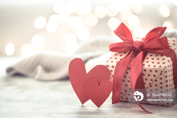 Background holiday, gift in a beautiful box with a heart .