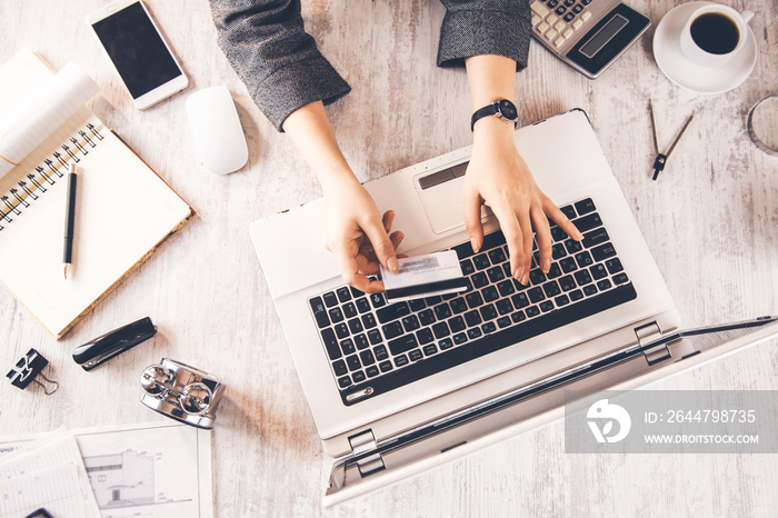 woman hand credit card with  keyboard on table