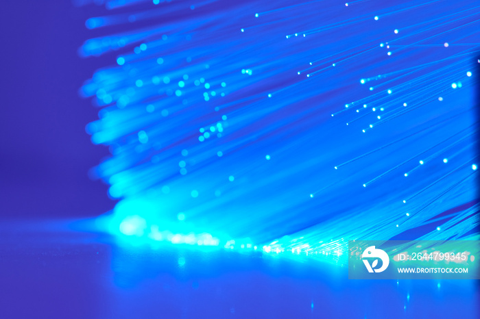 Background With Blue Fiber Optics And Reflections On The Table