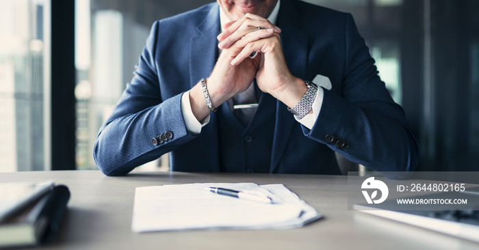 Businessman working on documents at office