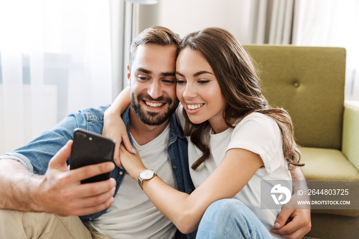 Beautiful young couple in love at home