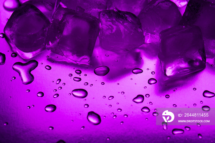 A pile of ice cubes in purple on a reflecting table