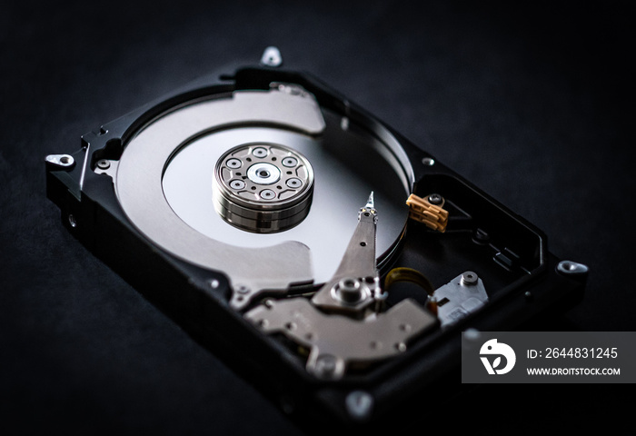 Closeup of hard drive storage disk on black table