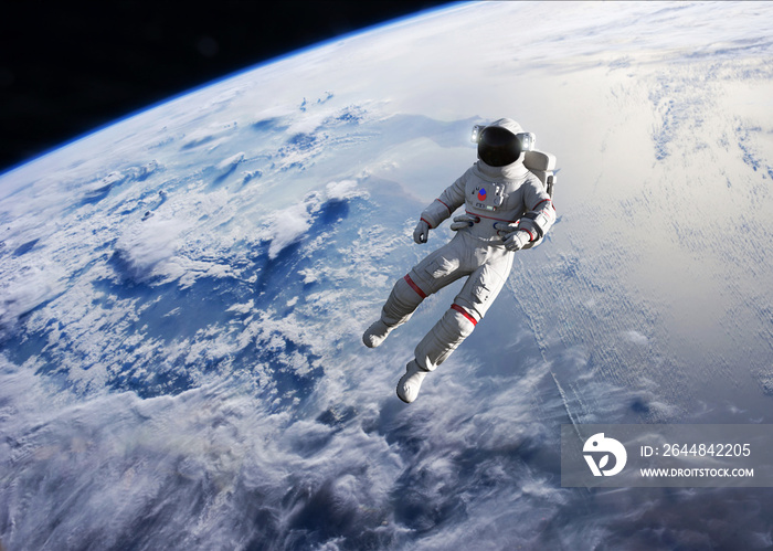 Astronaut conducting spacewalk on Earth orbit.