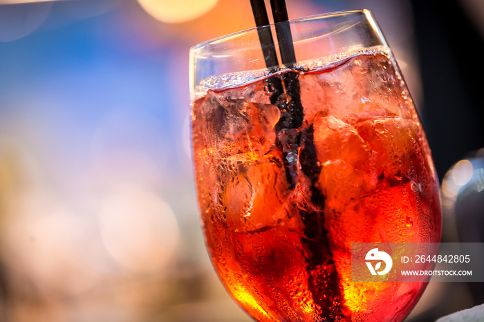 Aperol Spritz in glass, close up on blured background.