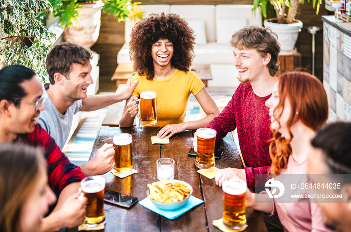 Young gen z people drinking beer at brewery bar terrace - Friendship life style concept with young m