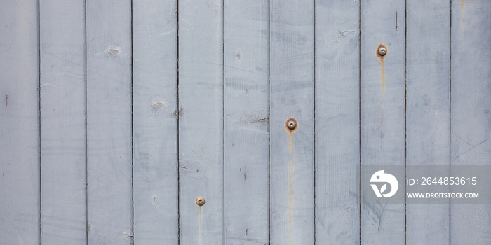 white grey wood texture Weathered Wooden Plank Barn Siding Background with Rusty Nail heads