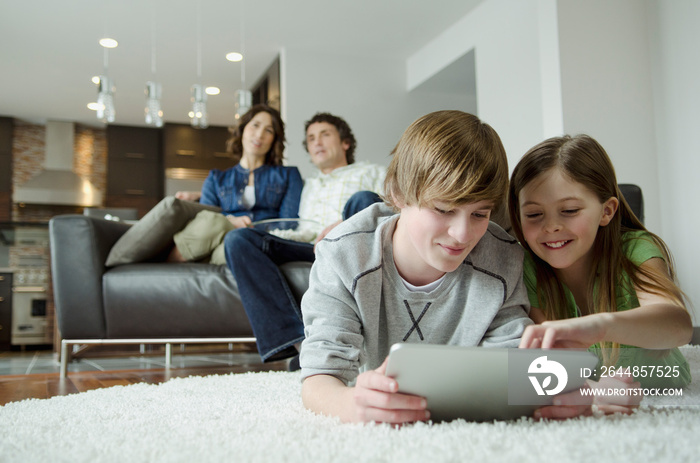 Family enjoying movie night and technology together