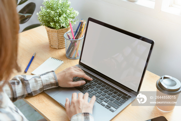 Businessman hands using laptop with blank screen. Mock-up of computer monitor. Copyspace ready for d