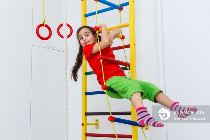 7 years old child playing on sports equipment