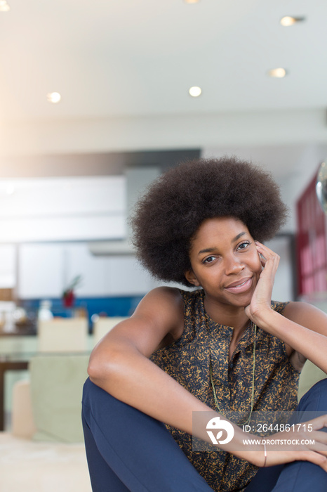 Portrait confident beautiful young woman with afro