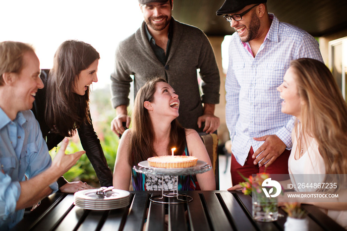 Smiling friends celebrating birthday