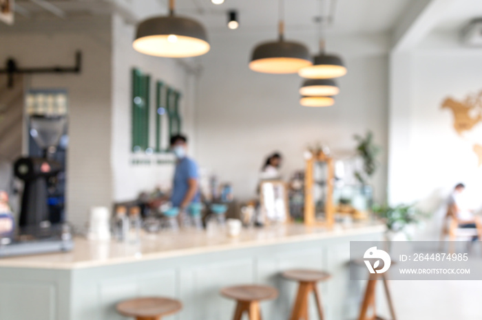 Blurred the atmosphere in the coffee shop, white tone. with blurred barista.