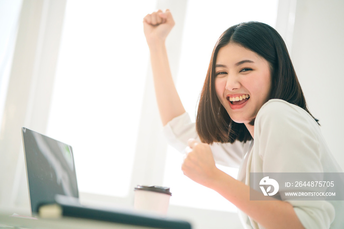 successful asian business offlce woman working with laptop with happiness and freshness emotion offi