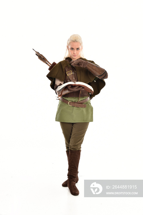 full length portrait of a blonde girl wearing green and brown medieval costume. standing pose isolat