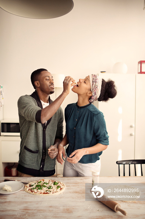 Couple sharing pizza