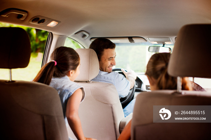 Man with daughters (8-9) on road trip