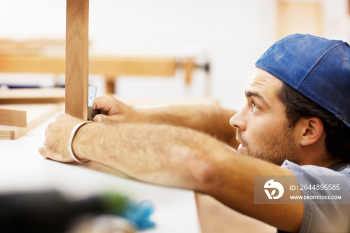 Carpenter skillfully building piece of furniture