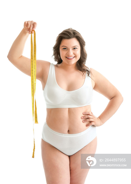 Plus size woman with measuring tape on white background. Concept of body positive