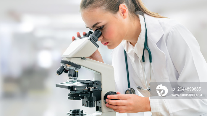 Scientist researcher using microscope in laboratory. Medical healthcare technology and pharmaceutica