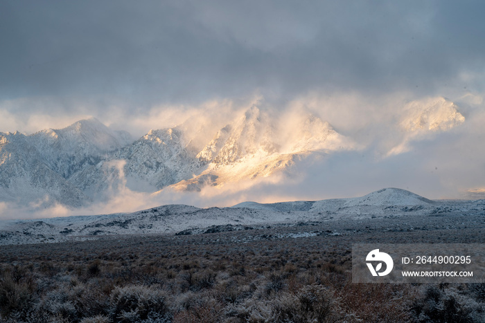 snow clouds in morning light deposited fresh snow on desert valley and Sierra Nevada mountain range