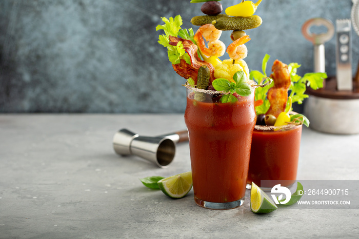 Bloody mary cocktail topped with variety of generous garnishes