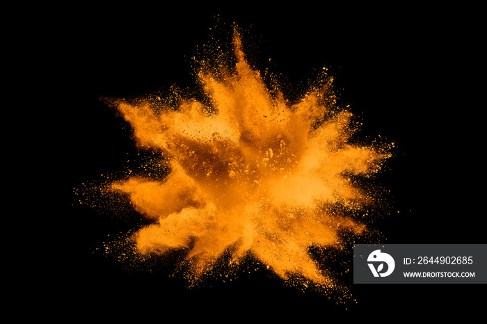 Orange powder explosion on dark background.