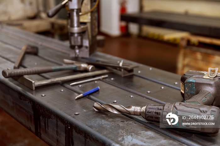 marking on a metal surface for drilling holes with a square and vernier calipers