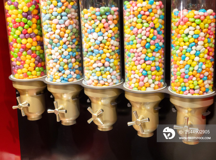 Colorful candy in the store, bulk store. Colorful jelly beans in a glass jar