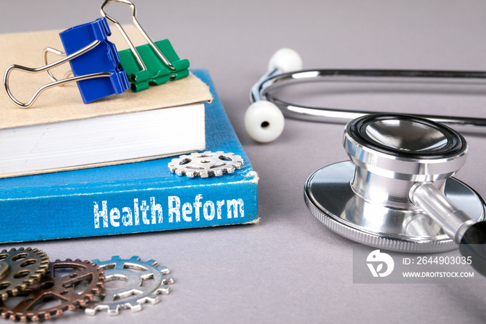 health reform concept. blue book on a gray office table. communication and information