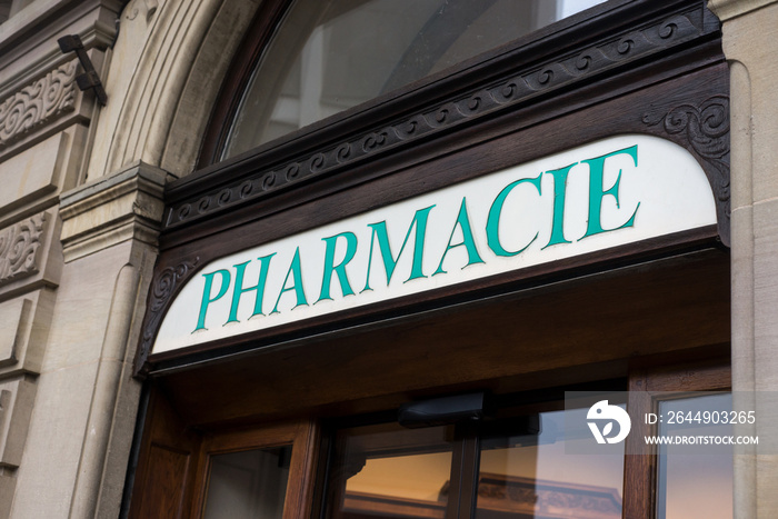 Closeup of french Pharmacy sign on store front in the street