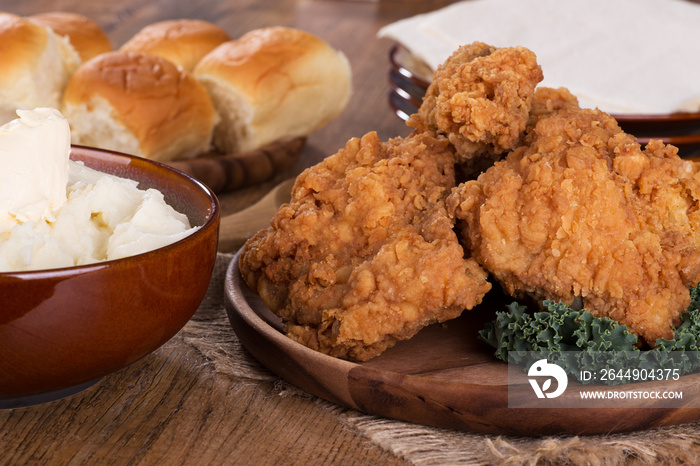 Crispy Fried Chicken Pieces on a Wooden Plate