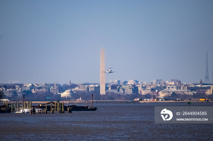 Airplane flying into airport near the DC monuments