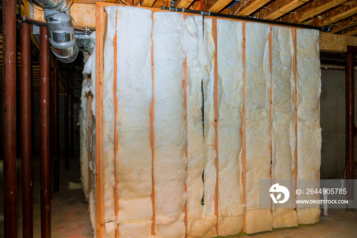 Insulation of basement with fiberglass cold barrier and insulation material