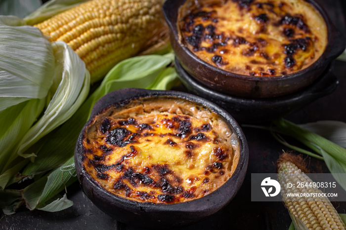 Latin American Corn pie. Chilean Pastel de Choclo in clay bowl