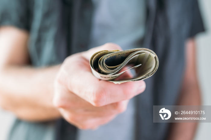 Man holding Serbian currency Dinar paper banknotes