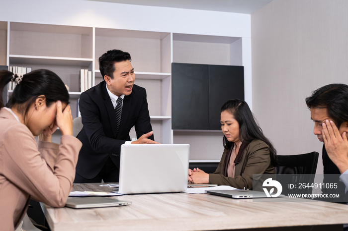 Asian men manager scold and angry with their employee inside of office meeting room with upset and stress worker. Business failure. Problem in working office issue.