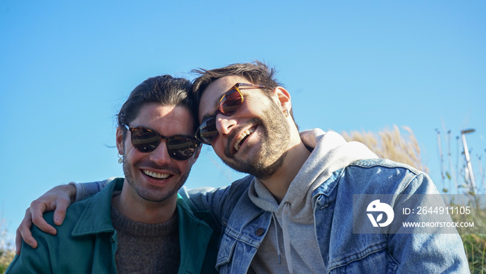 Portrait of smiling gay couple outdoors