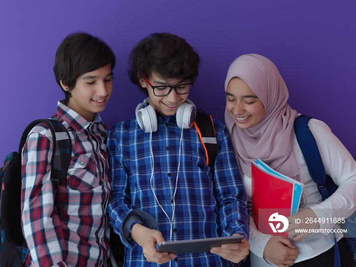 Arab teenagers group working on laptop  computer together