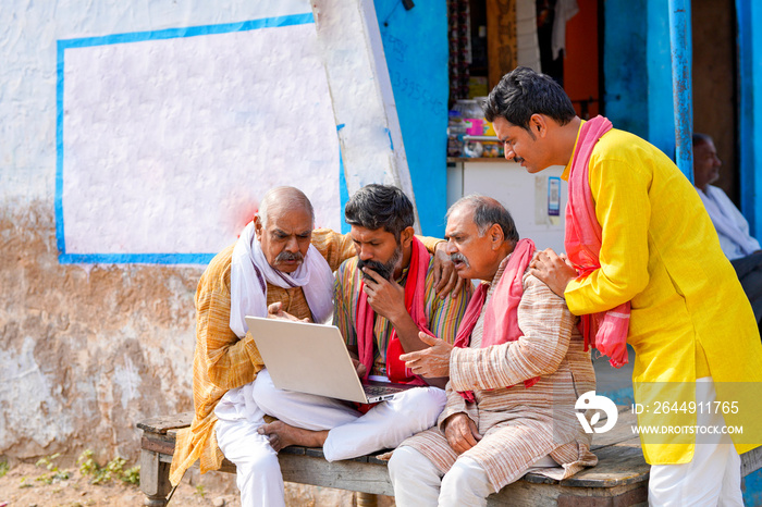 Indian farmer group giving shocking expression after see in laptop