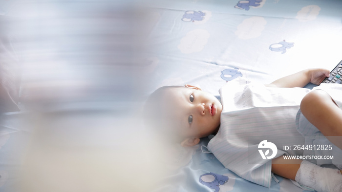 Young Boy Has a bright Face as he is resting in Quarintine in Hopsital Bed During Pandemic