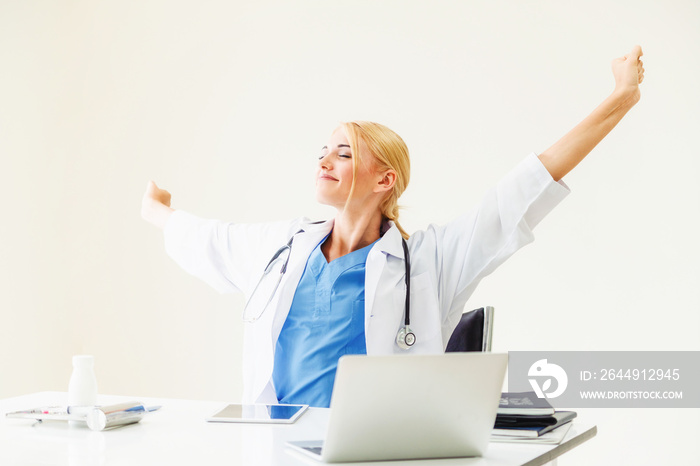 Relaxed doctor taking a break in hospital office.