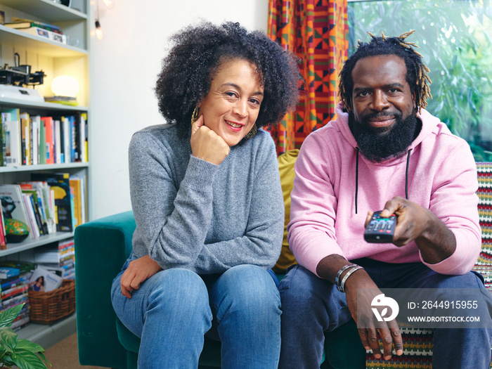 Portrait of couple sitting on sofa