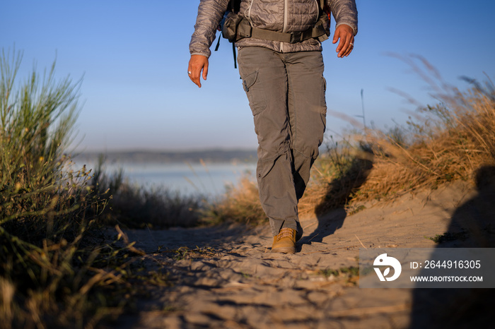 U.S. Army female soldier putting in the miles with an early morning hike in the NorthWest.