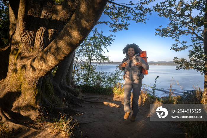 U.S. Army female soldier putting in the miles with an early morning hike in the NorthWest.