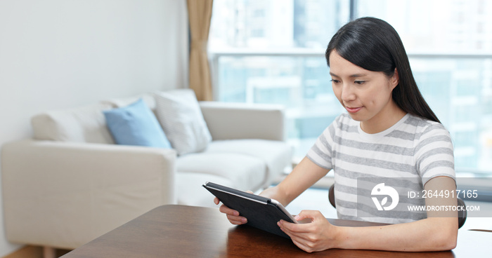 Woman read on computer at home